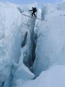 Tom crossing a crevasse in the Khumbu Icefall